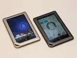 Two Barnes & Noble Nook tablets side by side on a white surface.